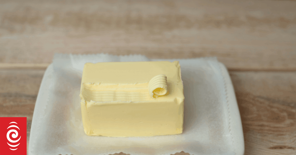 A block of butter on a white dish.