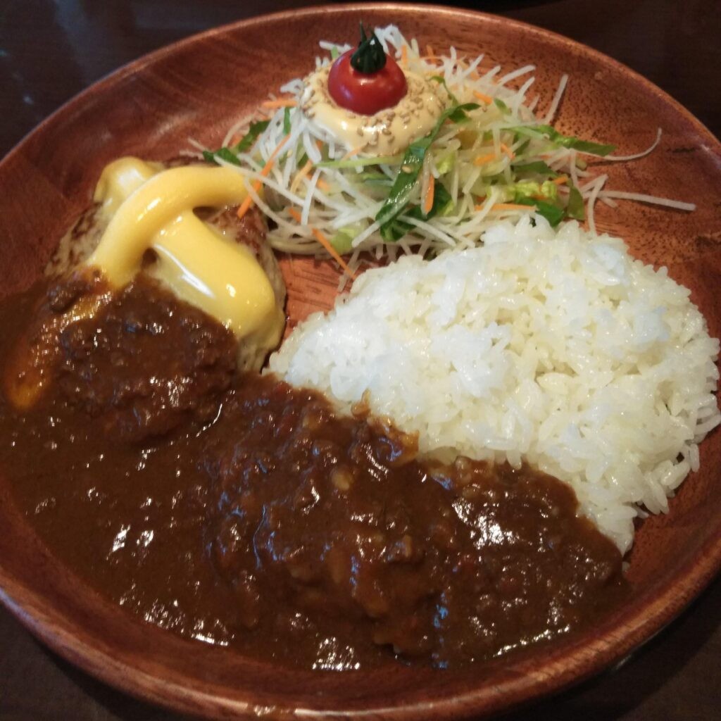 Hamburger steaks served with curry rice & salad